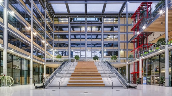 An image of a wide staircase in a light atrium at the drum wembley