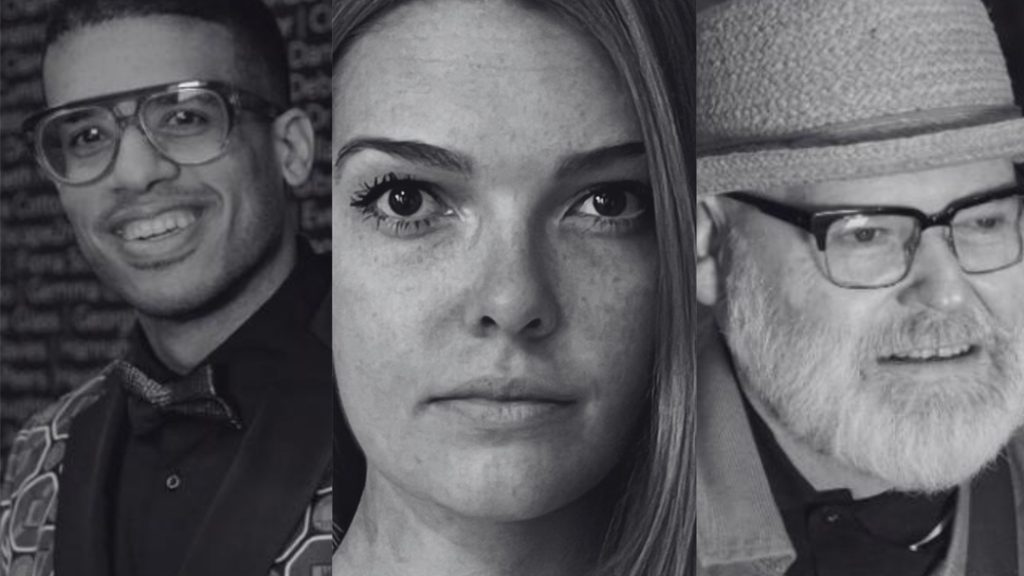 Three black and white close up photos of faces. The first face is a Black man with short curly black hair, blue glasses, wearing a green jacket with a bow tie, smiling, stood against a grey background that has names written all over it. The second is a white female with long dark blonde hair. She is wearing a white V-neck jumper off the shoulder to display a Hickman Line on her chest. She is looking straight at the camera. The third is an artist wearing a hat, black spectacles and a beard, looking at his artwork