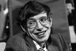 An image of Stephen Hawking, smiling at the camera